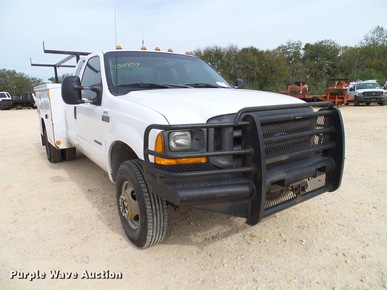 image for item DC2202 1999 Ford F350 Super Duty SuperCab utility bed pickup truck