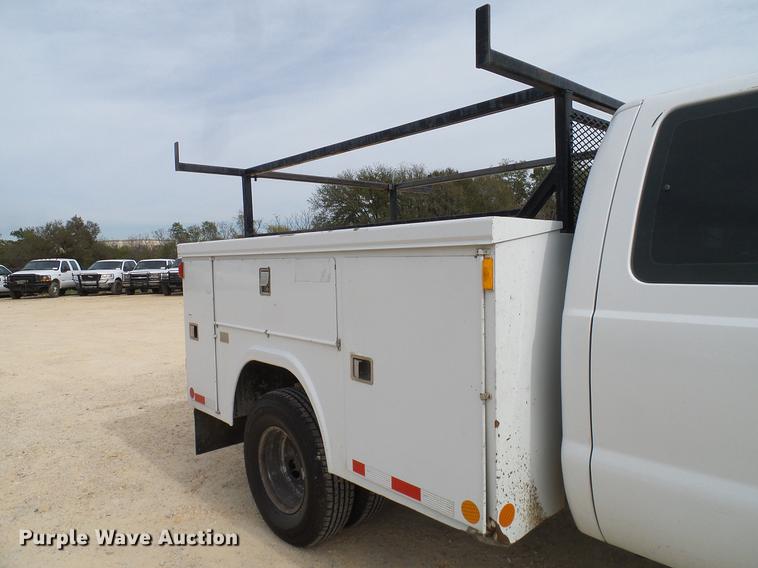 image for item DC2202 1999 Ford F350 Super Duty SuperCab utility bed pickup truck