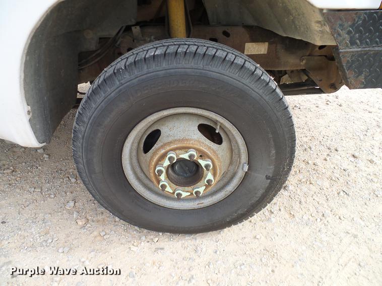 image for item DC2202 1999 Ford F350 Super Duty SuperCab utility bed pickup truck