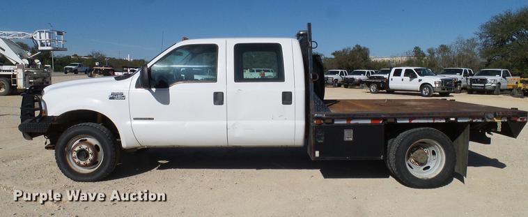 image for item DC2219 2002 Ford F450 Super Duty Crew Cab flatbed truck