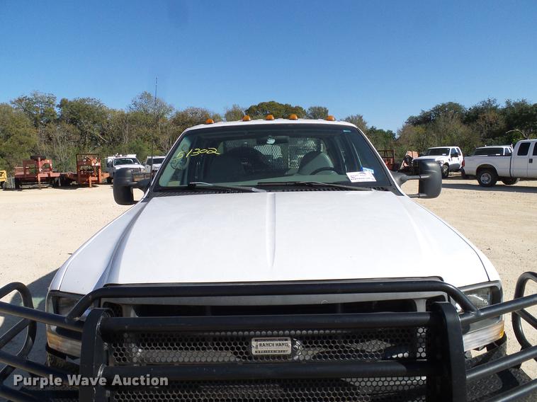 image for item DC2219 2002 Ford F450 Super Duty Crew Cab flatbed truck