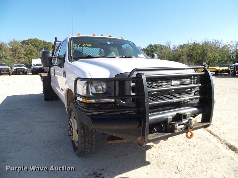 image for item DC2219 2002 Ford F450 Super Duty Crew Cab flatbed truck