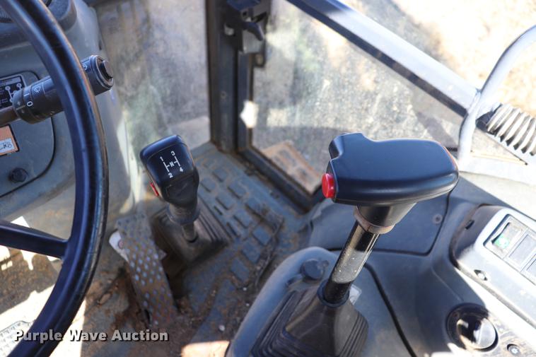 image for item ED9743 1999 New Holland 675 backhoe