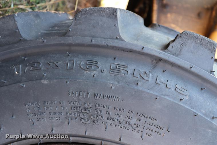 image for item ED9743 1999 New Holland 675 backhoe