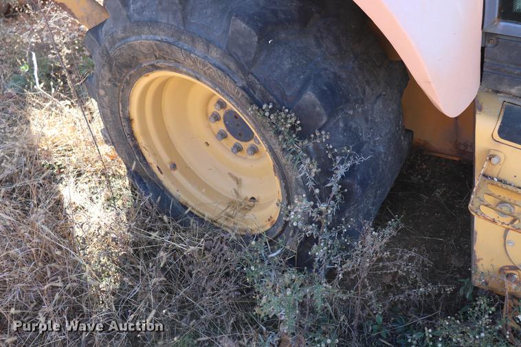 image for item ED9743 1999 New Holland 675 backhoe