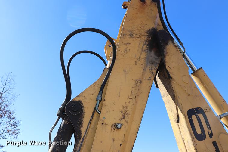 image for item ED9743 1999 New Holland 675 backhoe