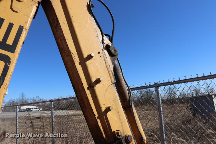 image for item ED9743 1999 New Holland 675 backhoe