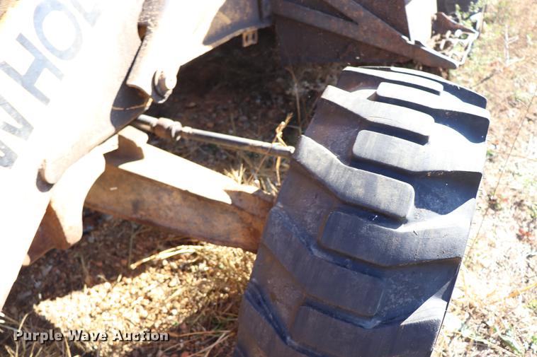 image for item ED9743 1999 New Holland 675 backhoe