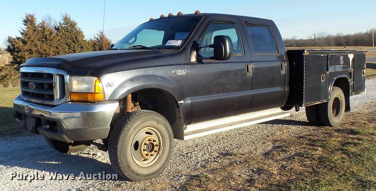 image for item DC7494 1999 Ford F350 Super Duty XLT Crew Cab utility bed pickup truck