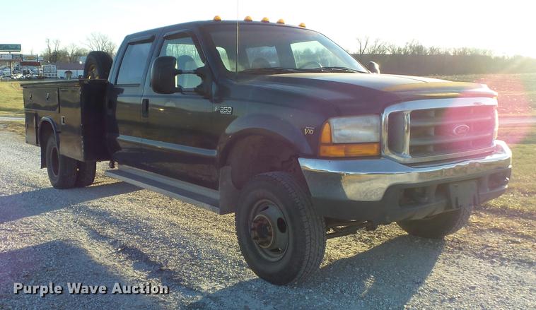 image for item DC7494 1999 Ford F350 Super Duty XLT Crew Cab utility bed pickup truck
