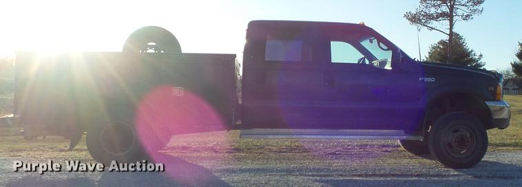 image for item DC7494 1999 Ford F350 Super Duty XLT Crew Cab utility bed pickup truck