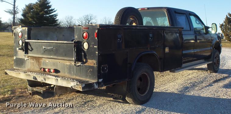 image for item DC7494 1999 Ford F350 Super Duty XLT Crew Cab utility bed pickup truck