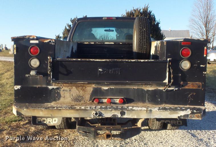 image for item DC7494 1999 Ford F350 Super Duty XLT Crew Cab utility bed pickup truck