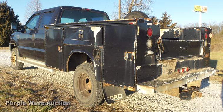 image for item DC7494 1999 Ford F350 Super Duty XLT Crew Cab utility bed pickup truck
