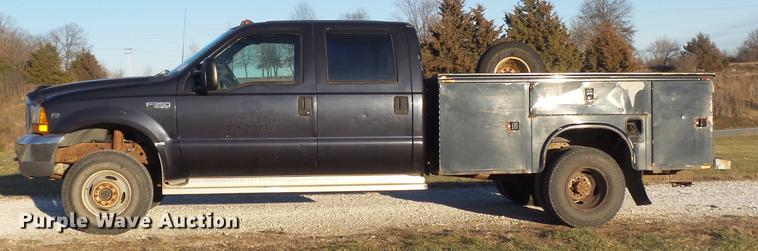 image for item DC7494 1999 Ford F350 Super Duty XLT Crew Cab utility bed pickup truck