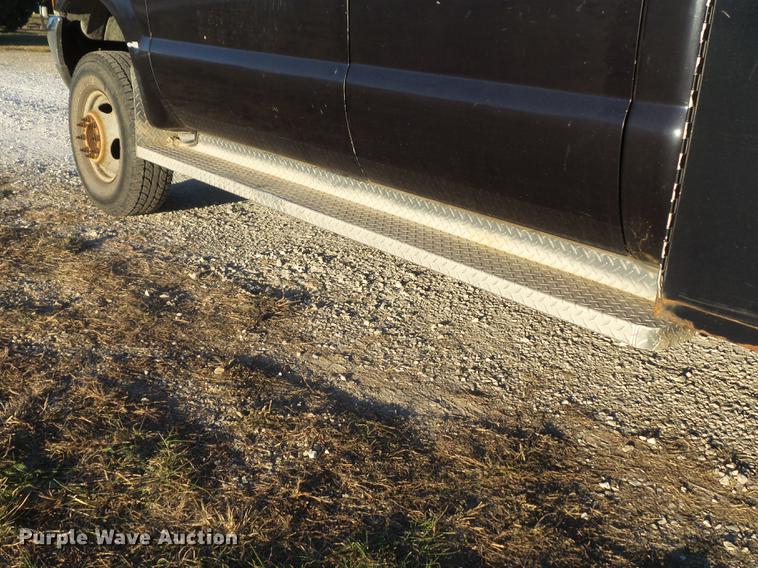 image for item DC7494 1999 Ford F350 Super Duty XLT Crew Cab utility bed pickup truck