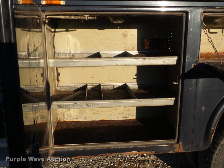 image for item DC7494 1999 Ford F350 Super Duty XLT Crew Cab utility bed pickup truck