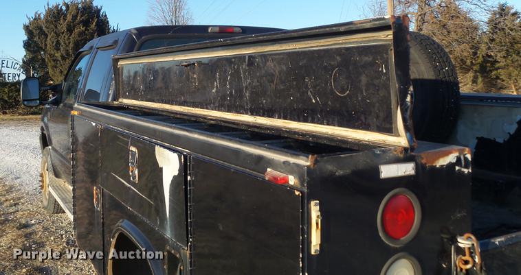 image for item DC7494 1999 Ford F350 Super Duty XLT Crew Cab utility bed pickup truck