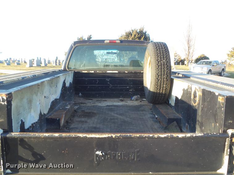 image for item DC7494 1999 Ford F350 Super Duty XLT Crew Cab utility bed pickup truck