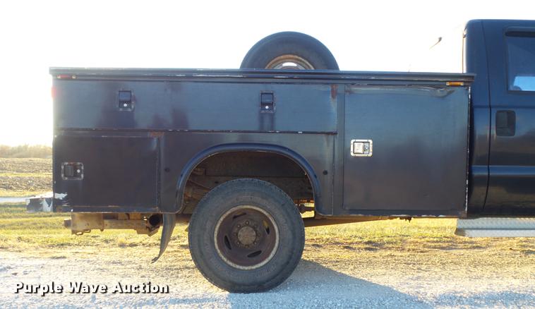 image for item DC7494 1999 Ford F350 Super Duty XLT Crew Cab utility bed pickup truck