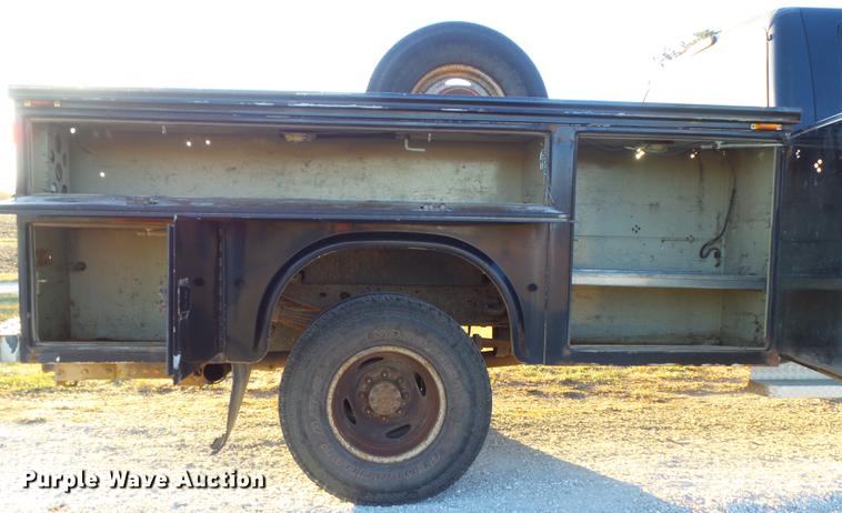 image for item DC7494 1999 Ford F350 Super Duty XLT Crew Cab utility bed pickup truck