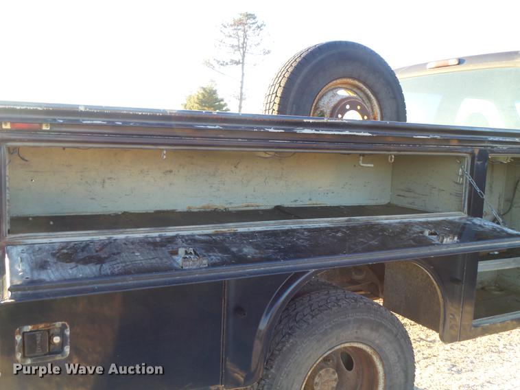 image for item DC7494 1999 Ford F350 Super Duty XLT Crew Cab utility bed pickup truck