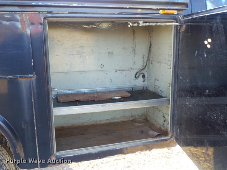 image for item DC7494 1999 Ford F350 Super Duty XLT Crew Cab utility bed pickup truck