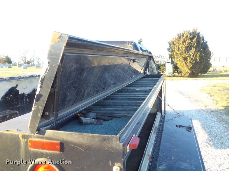 image for item DC7494 1999 Ford F350 Super Duty XLT Crew Cab utility bed pickup truck