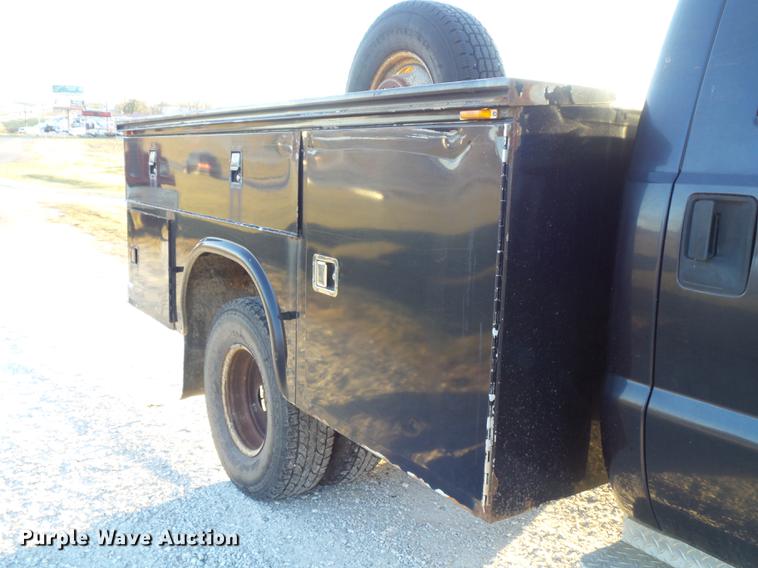 image for item DC7494 1999 Ford F350 Super Duty XLT Crew Cab utility bed pickup truck