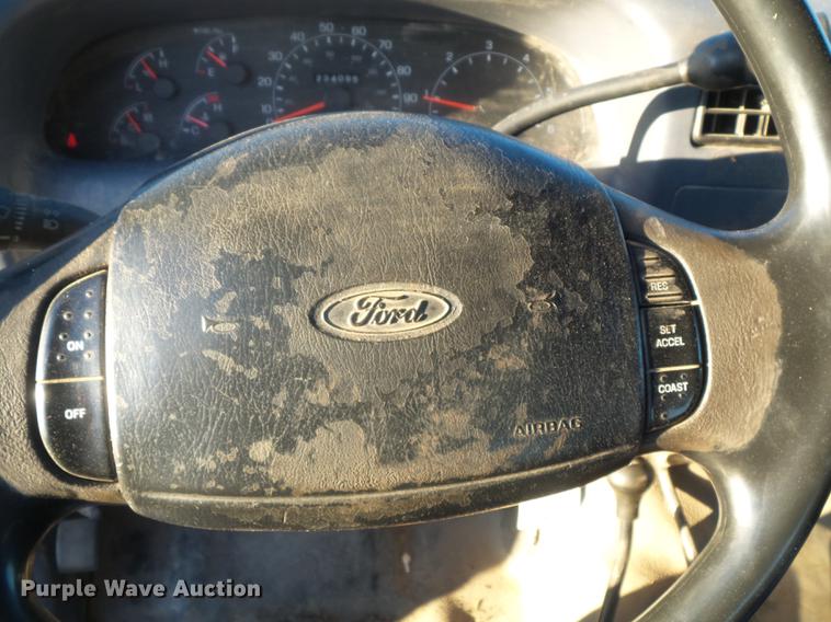 image for item DC7494 1999 Ford F350 Super Duty XLT Crew Cab utility bed pickup truck