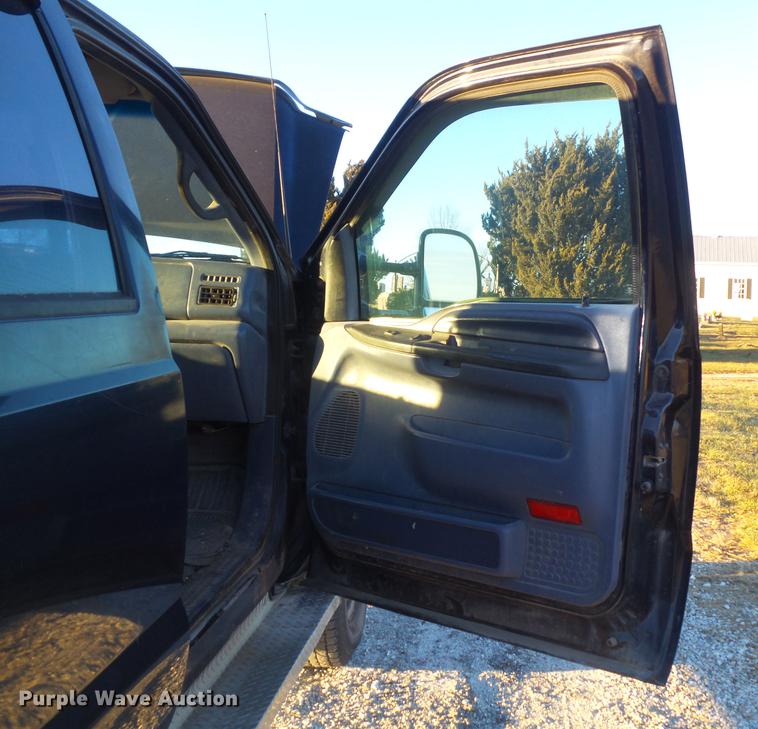 image for item DC7494 1999 Ford F350 Super Duty XLT Crew Cab utility bed pickup truck