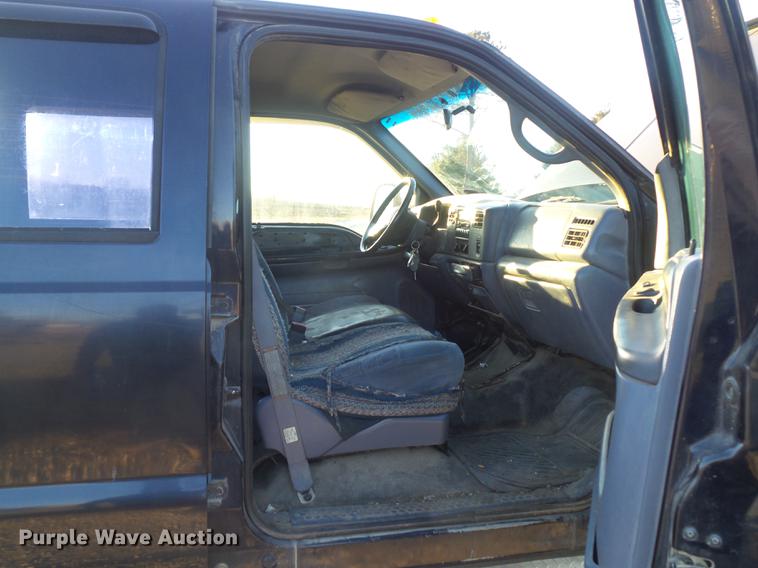 image for item DC7494 1999 Ford F350 Super Duty XLT Crew Cab utility bed pickup truck