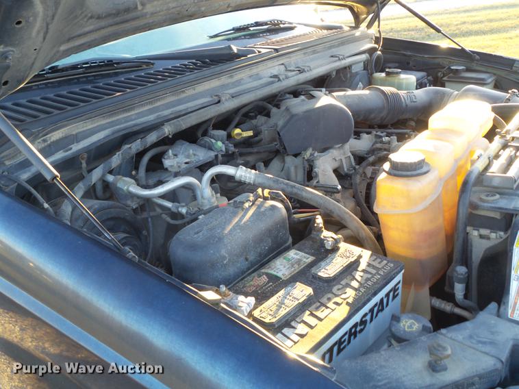 image for item DC7494 1999 Ford F350 Super Duty XLT Crew Cab utility bed pickup truck