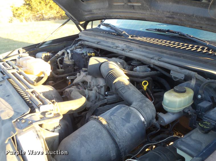 image for item DC7494 1999 Ford F350 Super Duty XLT Crew Cab utility bed pickup truck