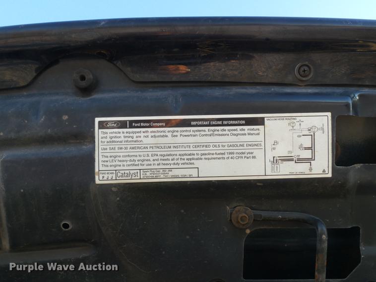 image for item DC7494 1999 Ford F350 Super Duty XLT Crew Cab utility bed pickup truck