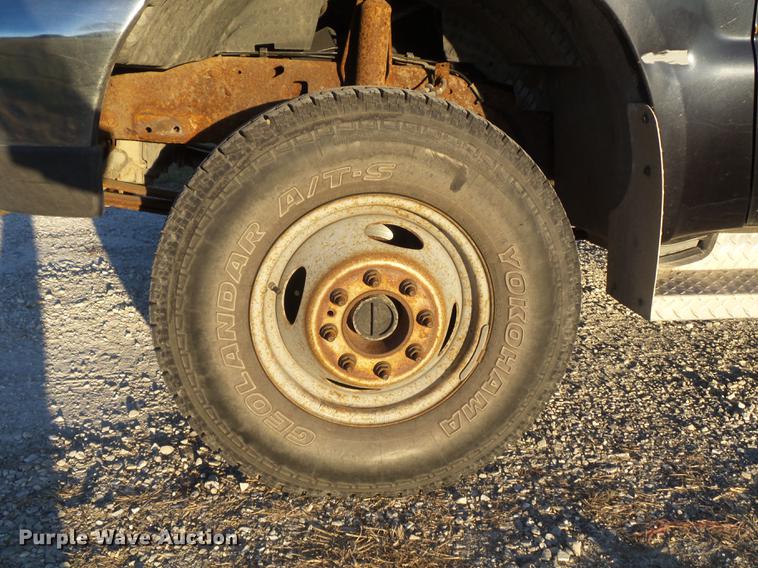 image for item DC7494 1999 Ford F350 Super Duty XLT Crew Cab utility bed pickup truck