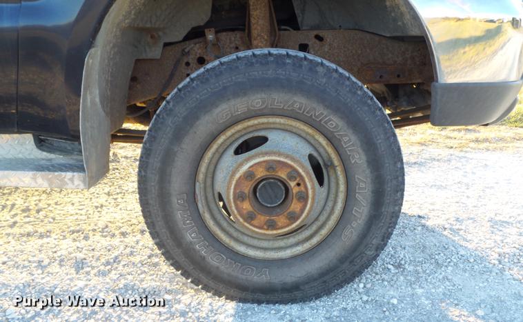 image for item DC7494 1999 Ford F350 Super Duty XLT Crew Cab utility bed pickup truck