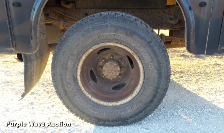 image for item DC7494 1999 Ford F350 Super Duty XLT Crew Cab utility bed pickup truck