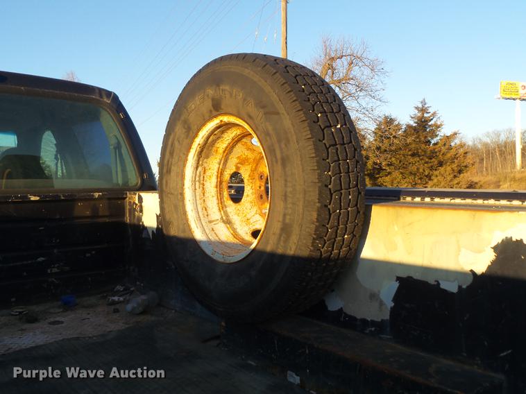 image for item DC7494 1999 Ford F350 Super Duty XLT Crew Cab utility bed pickup truck