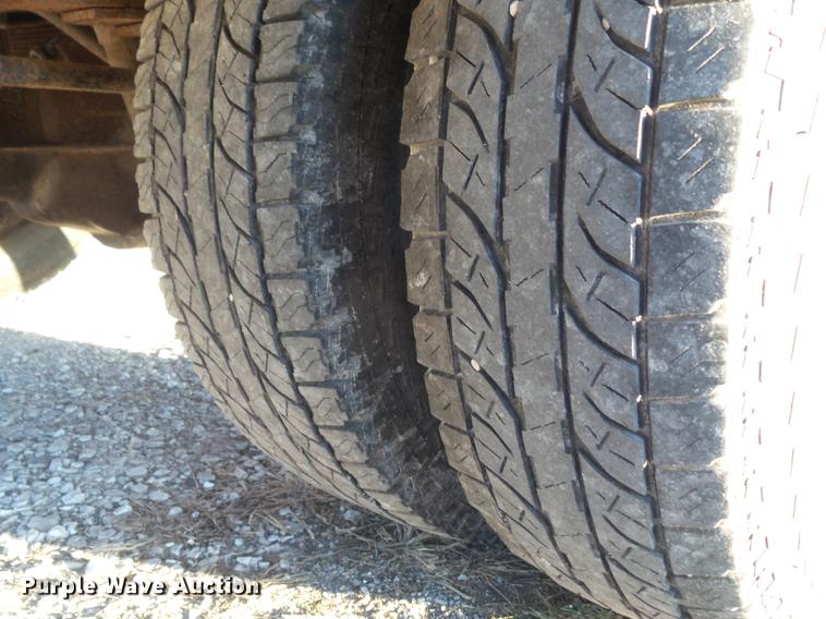 image for item DC7494 1999 Ford F350 Super Duty XLT Crew Cab utility bed pickup truck