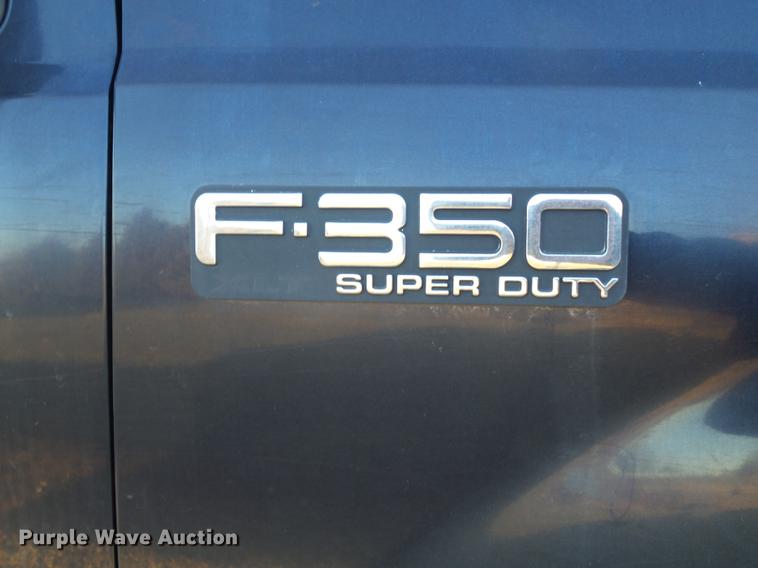 image for item DC7494 1999 Ford F350 Super Duty XLT Crew Cab utility bed pickup truck