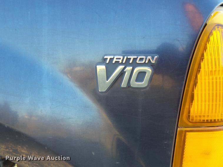 image for item DC7494 1999 Ford F350 Super Duty XLT Crew Cab utility bed pickup truck