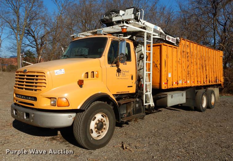 image for item J5564 2002 Sterling L8500 tree grapple truck