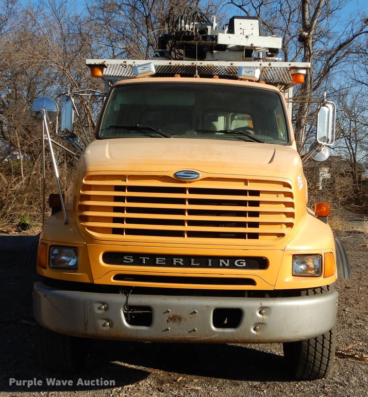 image for item J5564 2002 Sterling L8500 tree grapple truck