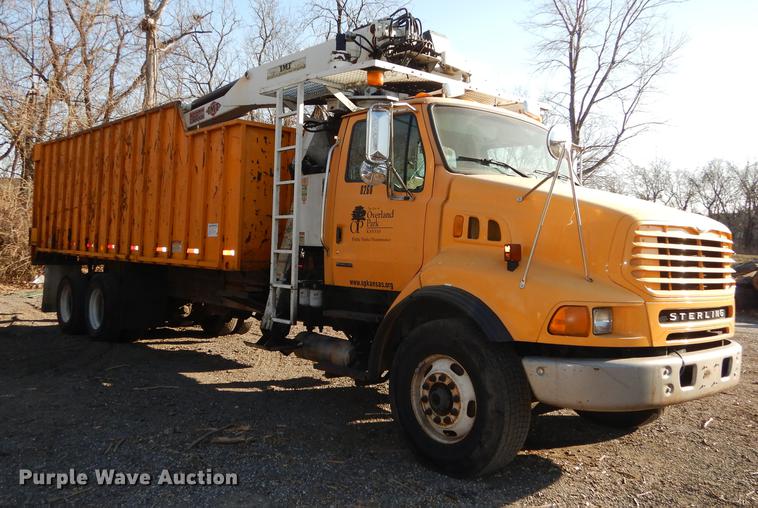 image for item J5564 2002 Sterling L8500 tree grapple truck