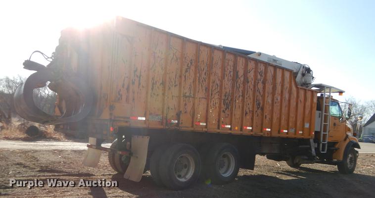 image for item J5564 2002 Sterling L8500 tree grapple truck