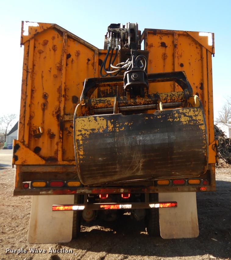 image for item J5564 2002 Sterling L8500 tree grapple truck