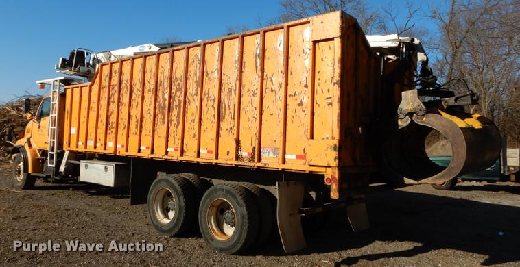 image for item J5564 2002 Sterling L8500 tree grapple truck