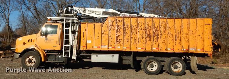 image for item J5564 2002 Sterling L8500 tree grapple truck