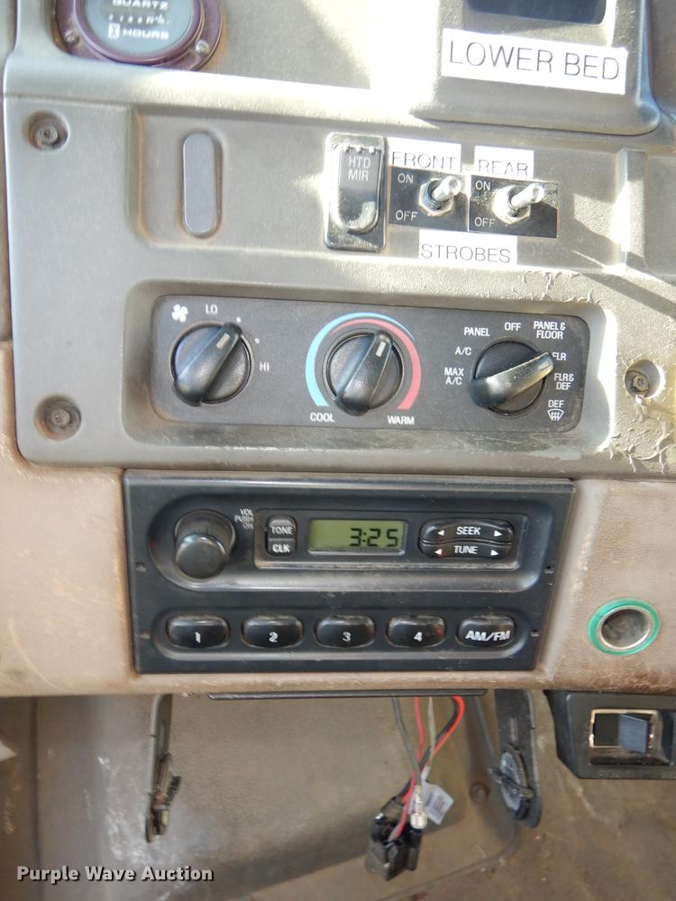 image for item J5564 2002 Sterling L8500 tree grapple truck